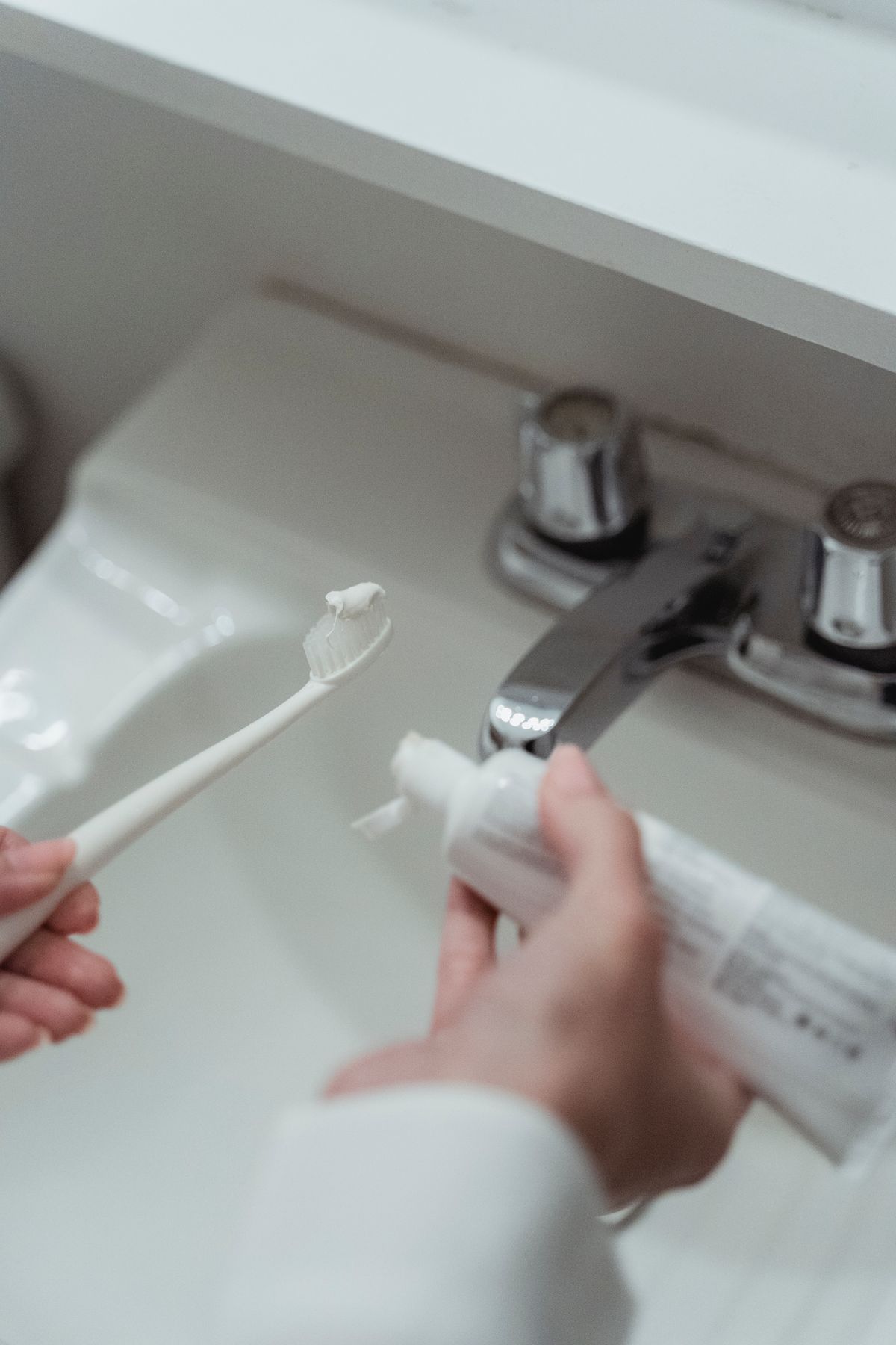 Clean bathroom counter set up for a daily oral care routine